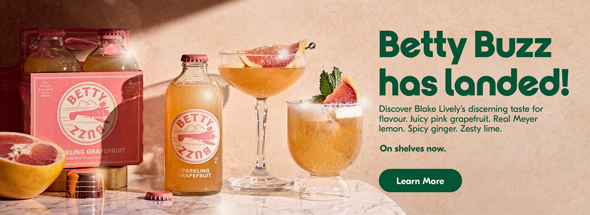 The following image contains the text, " Betty Buzz has landed! Discover black lively's discerning taste for flavour. Juicy pink grapefruit. Real Meyer lemon. Spicy ginger. Zesty lime. It is on shelves now, along with the Learn More button."