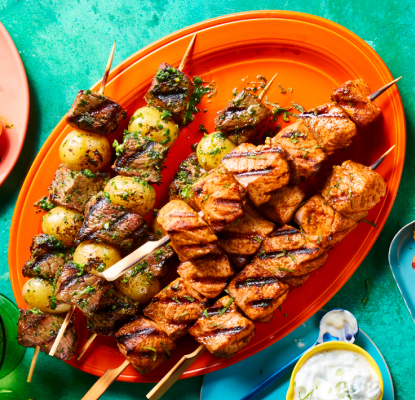 Platters of grilled meat skewers and kabobs