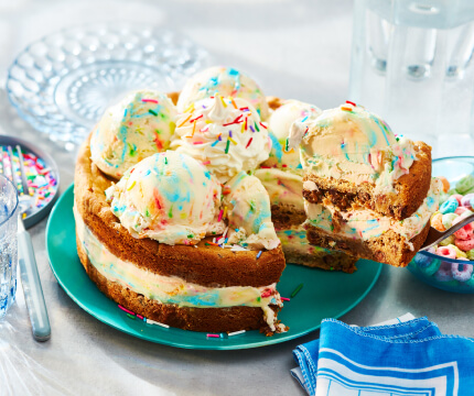 Layered chocolate chip cookie and birthday cake flavoured ice cream ice cream cake