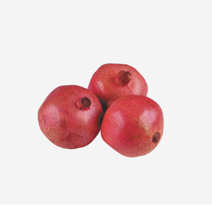 Three fresh whole pomegranates.