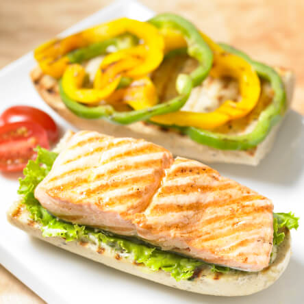 Grilled sockeye salmon and sweet peppers on olive bread