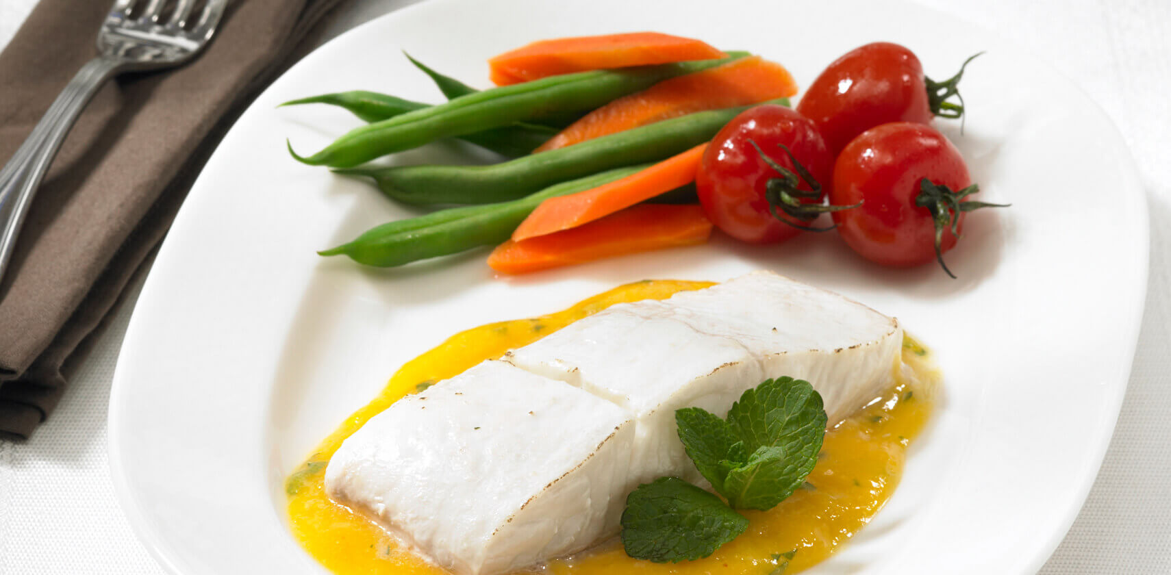 Halibut filet with mango and lime honey sauce
