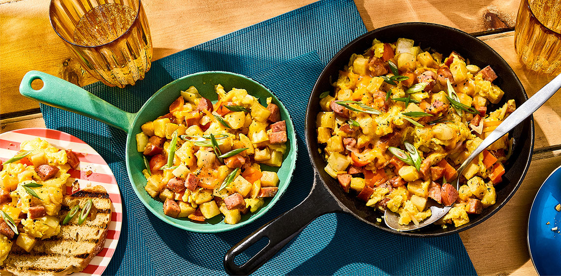 Campfire skillet breakfast with grilled bread on the side