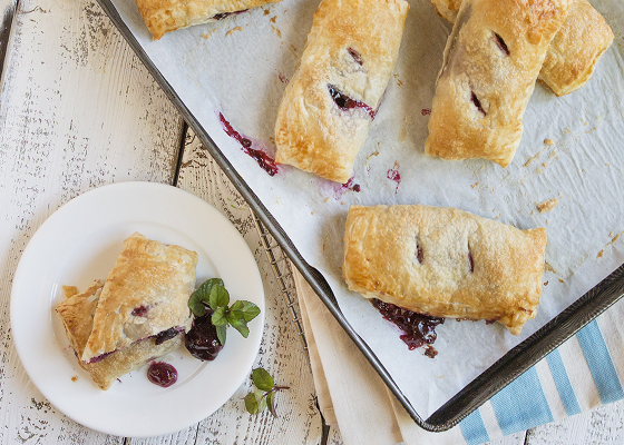 Cherry hand pie on a plate.
