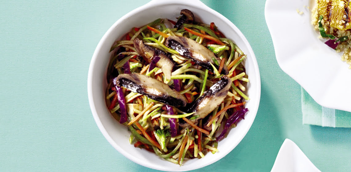 Small white pot with Grilled Mushroom & Broccoli Slaw.