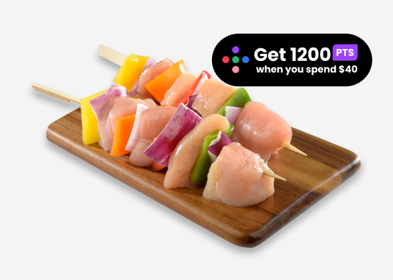 Chicken kabobs on wooden plate