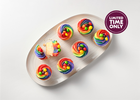 Overhead shot of Skittles cupcakes with colourful icing