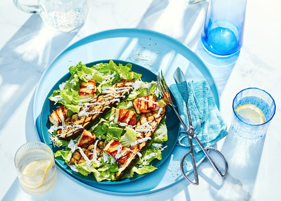 A platter of Grilled Zucchini Caesar Salad with Halloumi Cheese Croutons.
