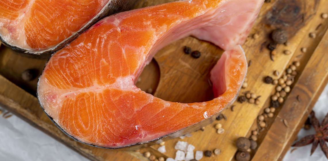Atlantic-salmon CLose-up for 2 sockeye salmon steaks on cutting board
